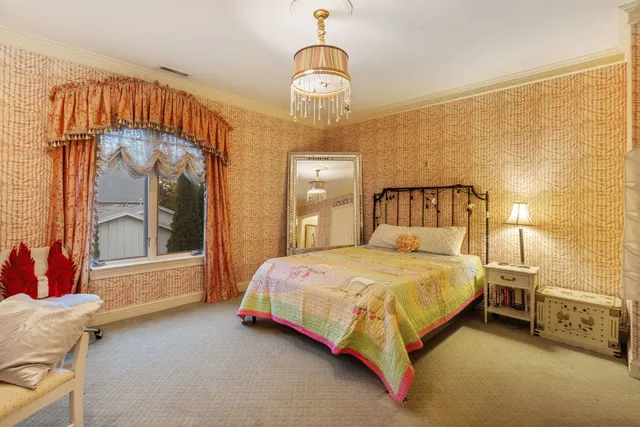 a front view of a house with a yard table and chairs