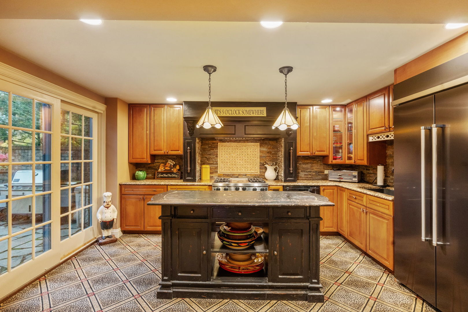 561 West 58th Street Hinsdale, IL 60521 - Photo 63 of 87 a kitchen with stainless steel appliances granite countertop a stove and a refrigerator