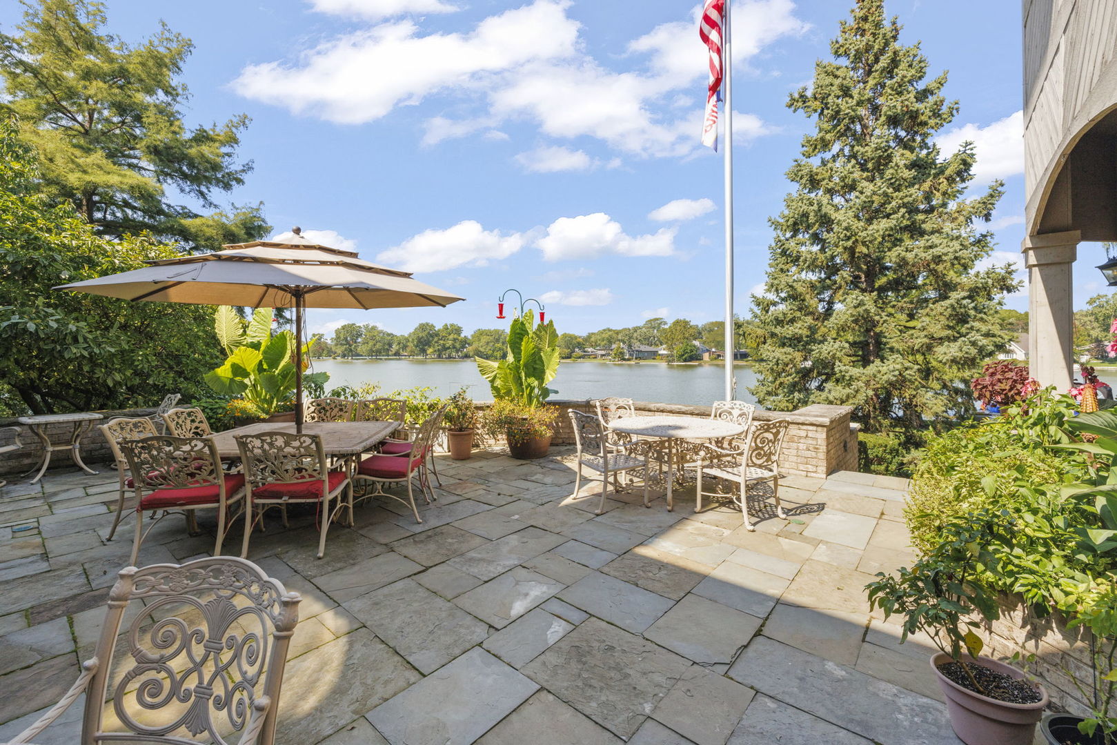 561 West 58th Street Hinsdale, IL 60521 - Photo 66 of 87 a view of a patio with a table and chairs under an umbrella