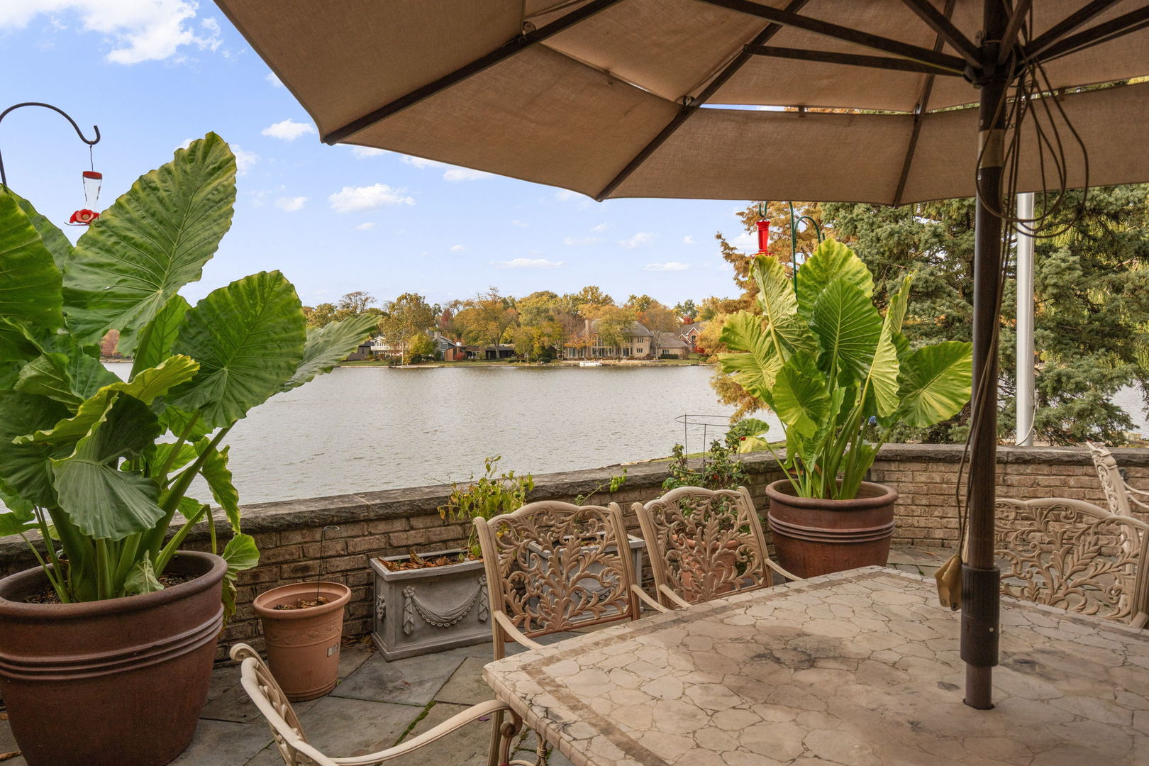 561 West 58th Street Hinsdale, IL 60521 - Photo 69 of 87 a view of a balcony with lake view and a potted plant