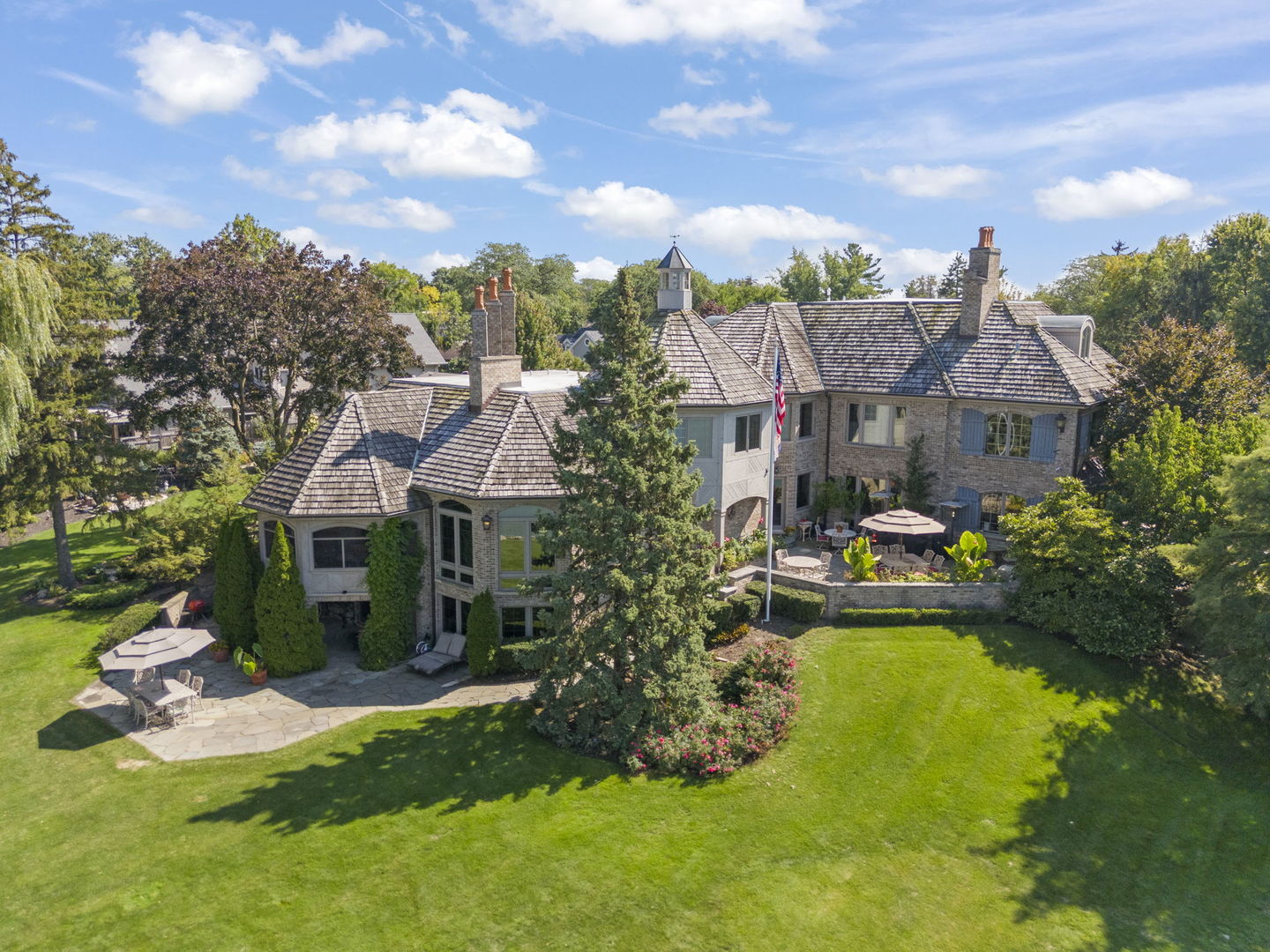 561 West 58th Street Hinsdale, IL 60521 - Photo 78 of 87 a front view of a house with a yard table and chairs