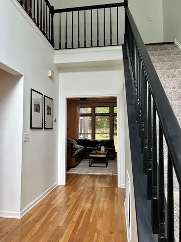a hallway with a stove and a refrigerator