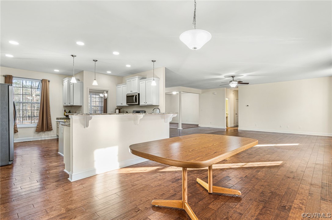 1602 Blakely Road Crozier, VA 23039 - Photo 13 of 44 a large kitchen with kitchen island a sink table and chairs