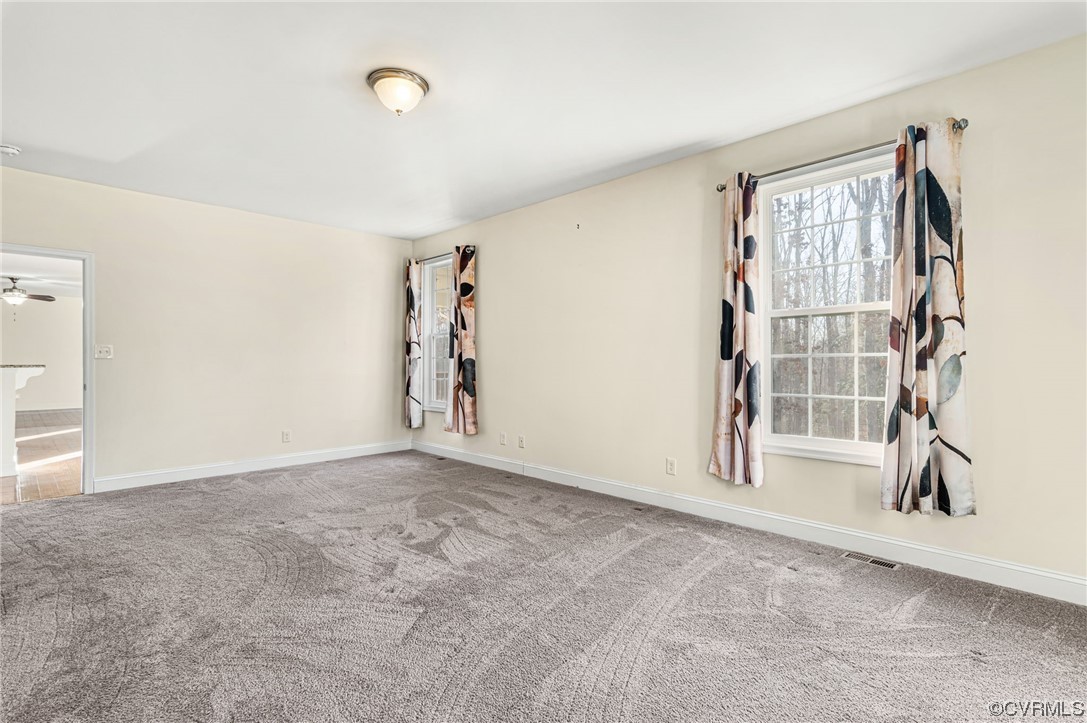 1602 Blakely Road Crozier, VA 23039 - Photo 18 of 44 a view of an empty room with a window