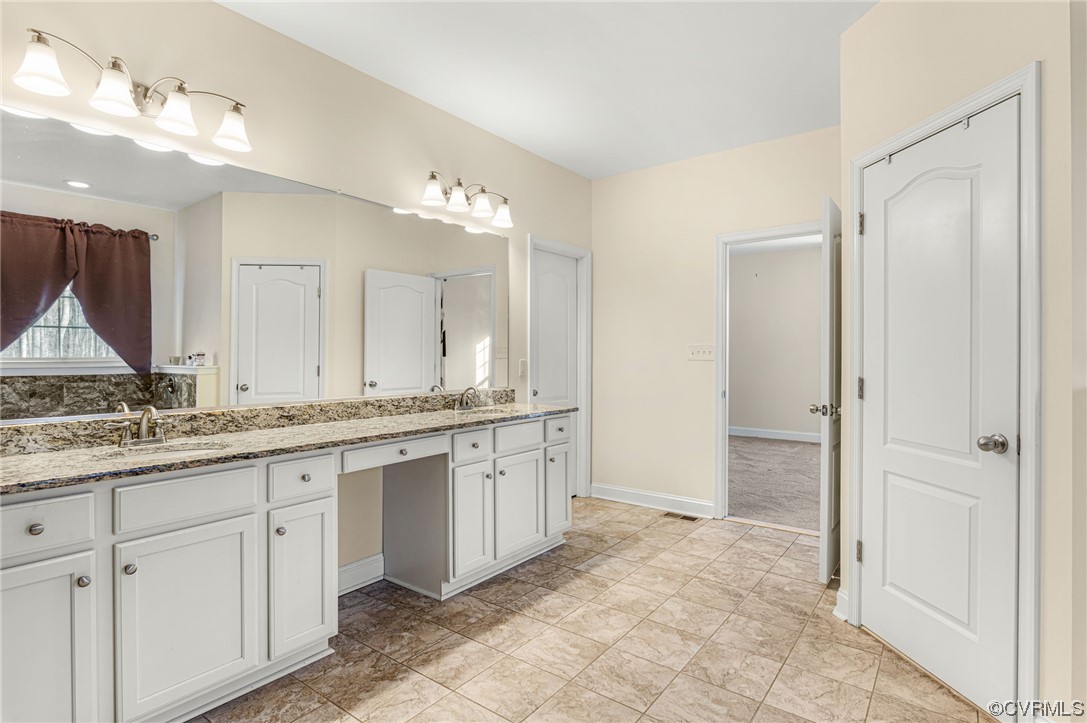 1602 Blakely Road Crozier, VA 23039 - Photo 21 of 44 a bathroom with a granite countertop sink and a mirror