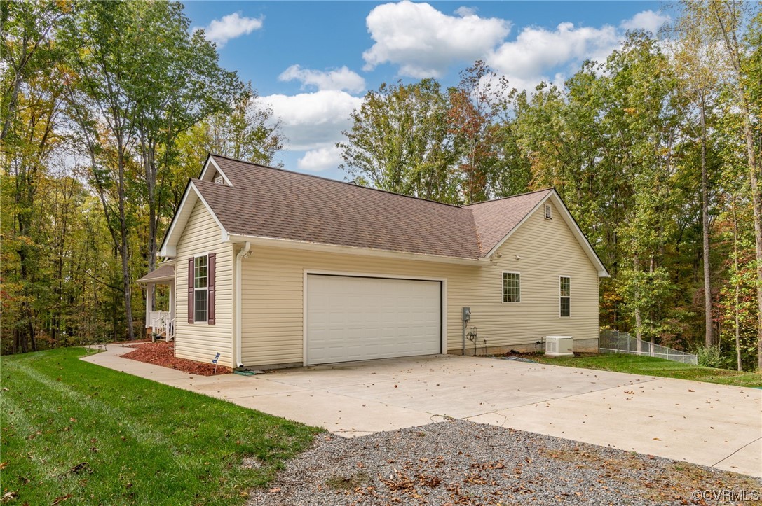 1602 Blakely Road Crozier, VA 23039 - Photo 32 of 44 a view of a house with a yard and garage