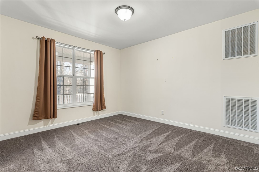 1602 Blakely Road Crozier, VA 23039 - Photo 5 of 44 an empty room with windows
