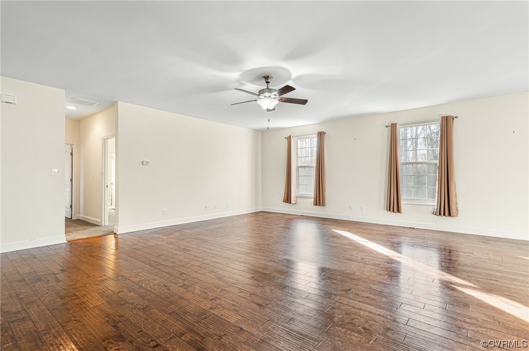 1602 Blakely Road Crozier, VA 23039 - Photo 7 of 44 a view of an empty room with window and wooden floor