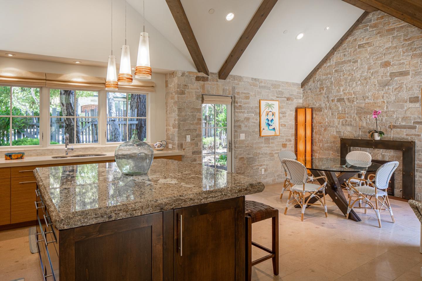 0 Monte Verde & 13th Corner Carmel, CA 93923 - Photo 7 of 31 a kitchen with stainless steel appliances granite countertop a table chairs and a large window