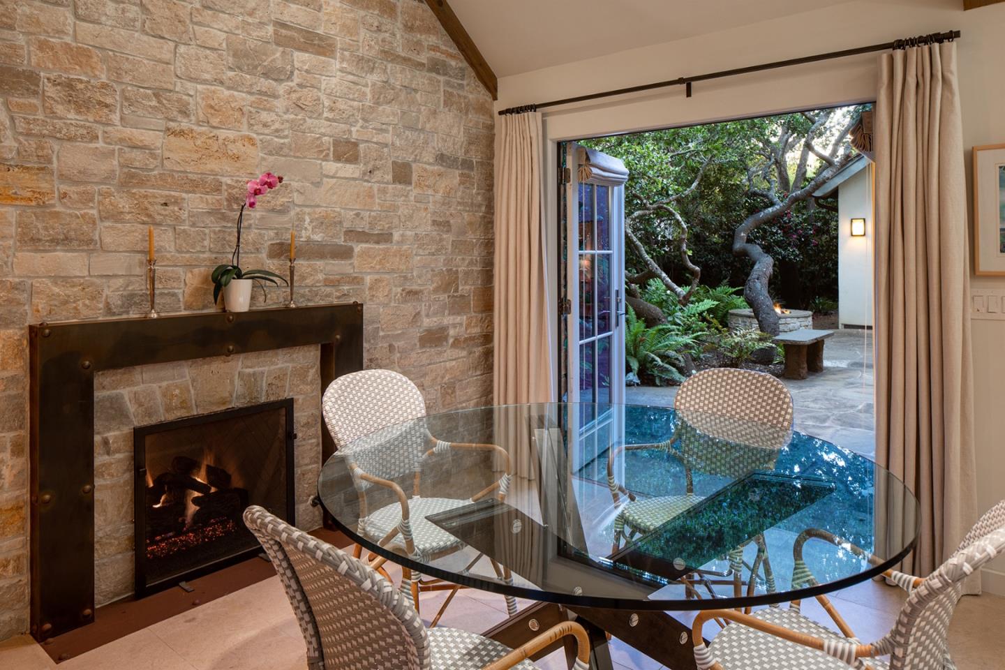 0 Monte Verde & 13th Corner Carmel, CA 93923 - Photo 9 of 31 a dining room with furniture and a fireplace