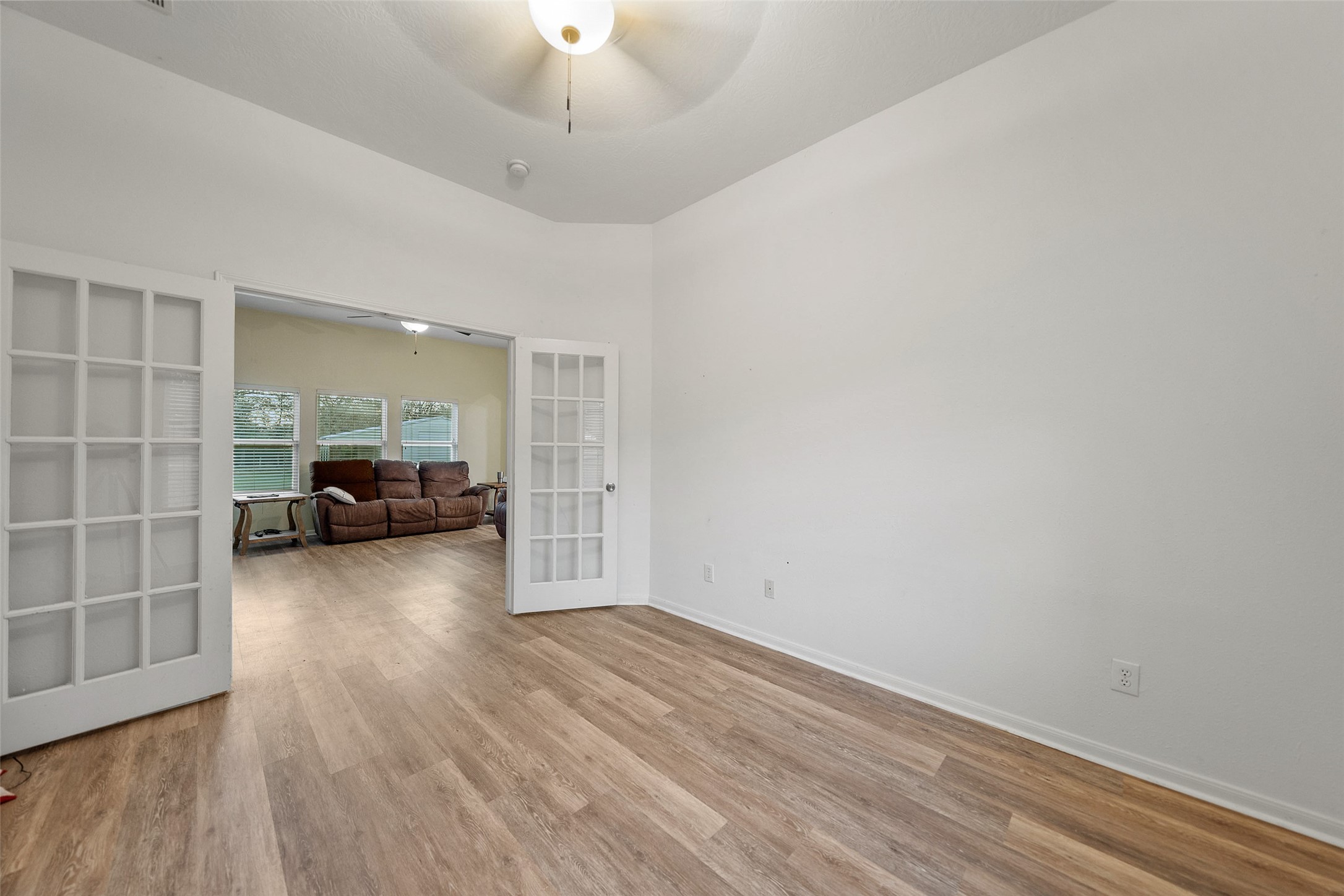 118 Pin Oak Lane Hempstead, TX 77445 - Photo 15 of 33 Versatile flex room with French doors—ideal for a home office, study, or additional living space.
