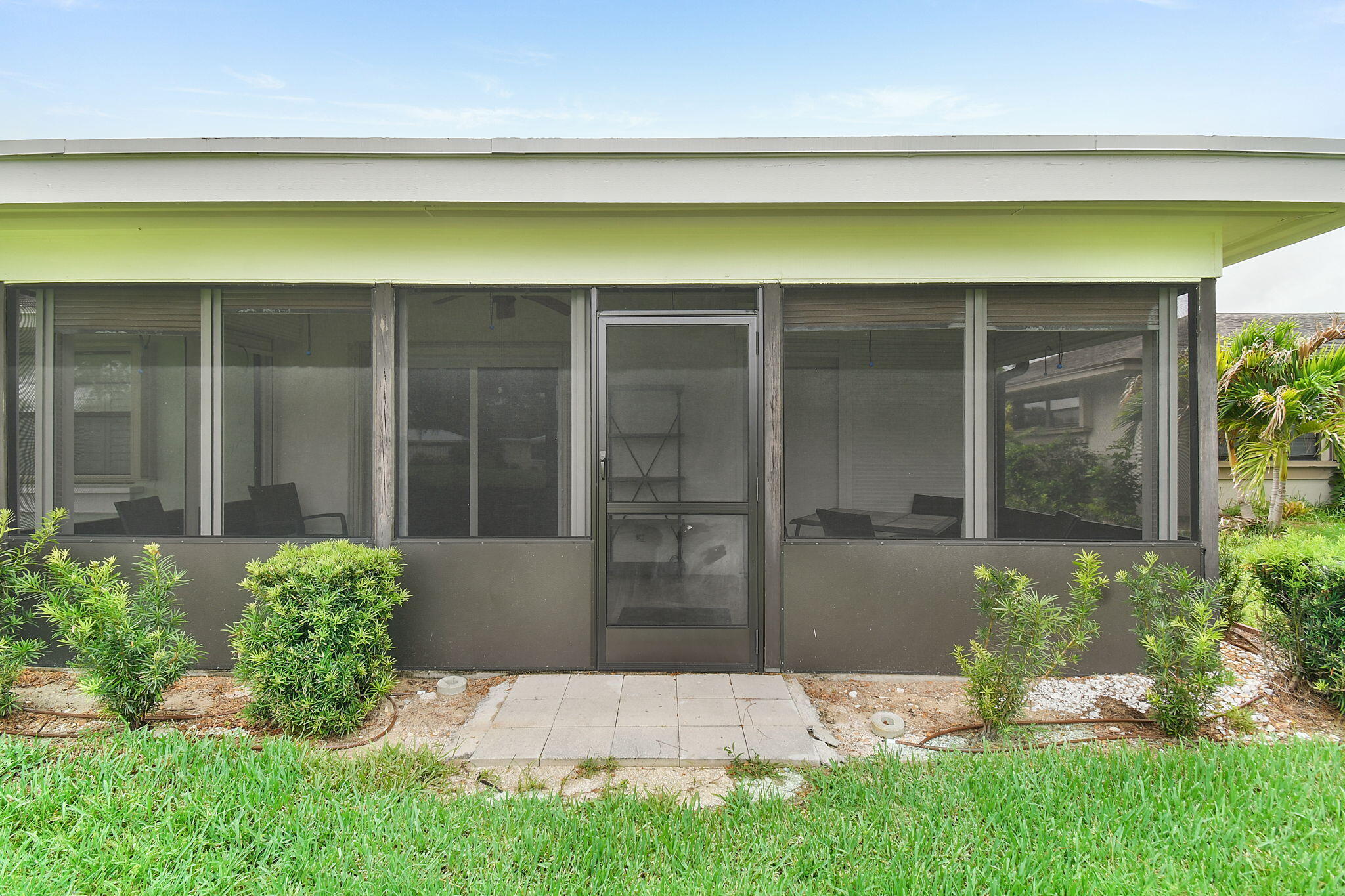 5251 Southeast Sea Island Way Stuart, FL 34997 - Photo 32 of 68 a front view of a house with a yard