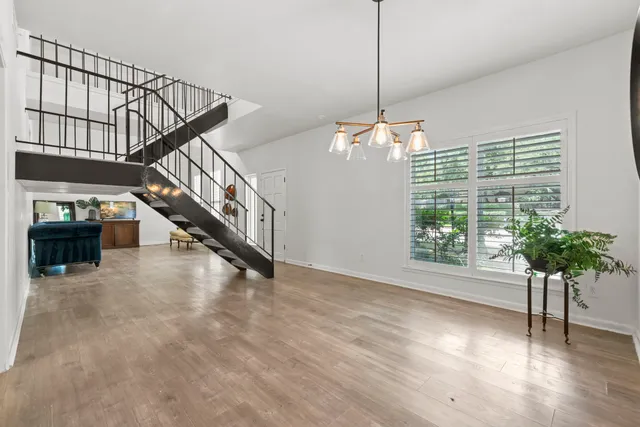 a view of an entryway with wooden floor