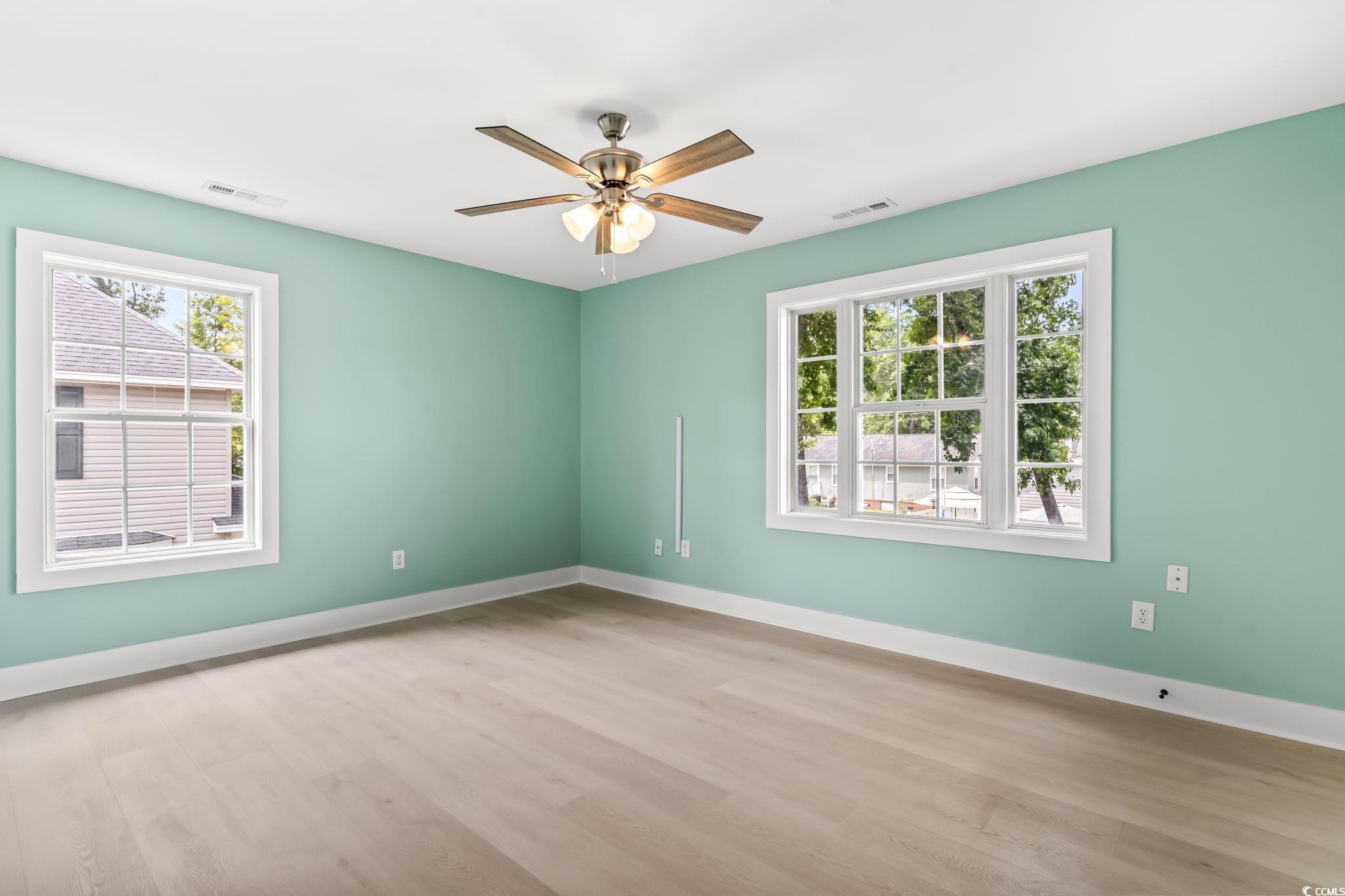 540 Boundary Avenue Murrells Inlet, SC 29576 - Photo 17 of 40 Spare room with a healthy amount of sunlight, wood