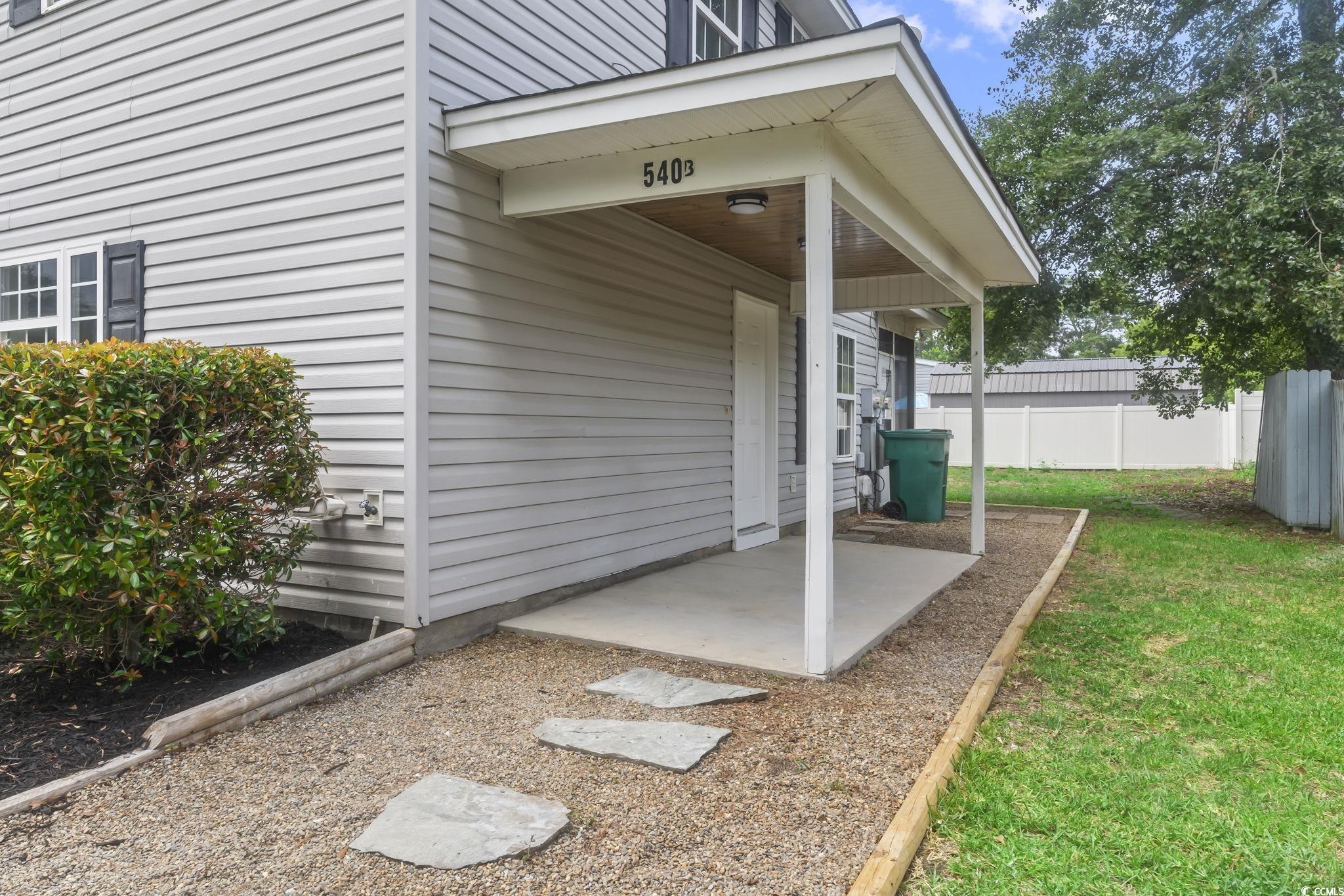 540 Boundary Avenue Murrells Inlet, SC 29576 - Photo 21 of 40 Exterior space featuring a patio and a yard