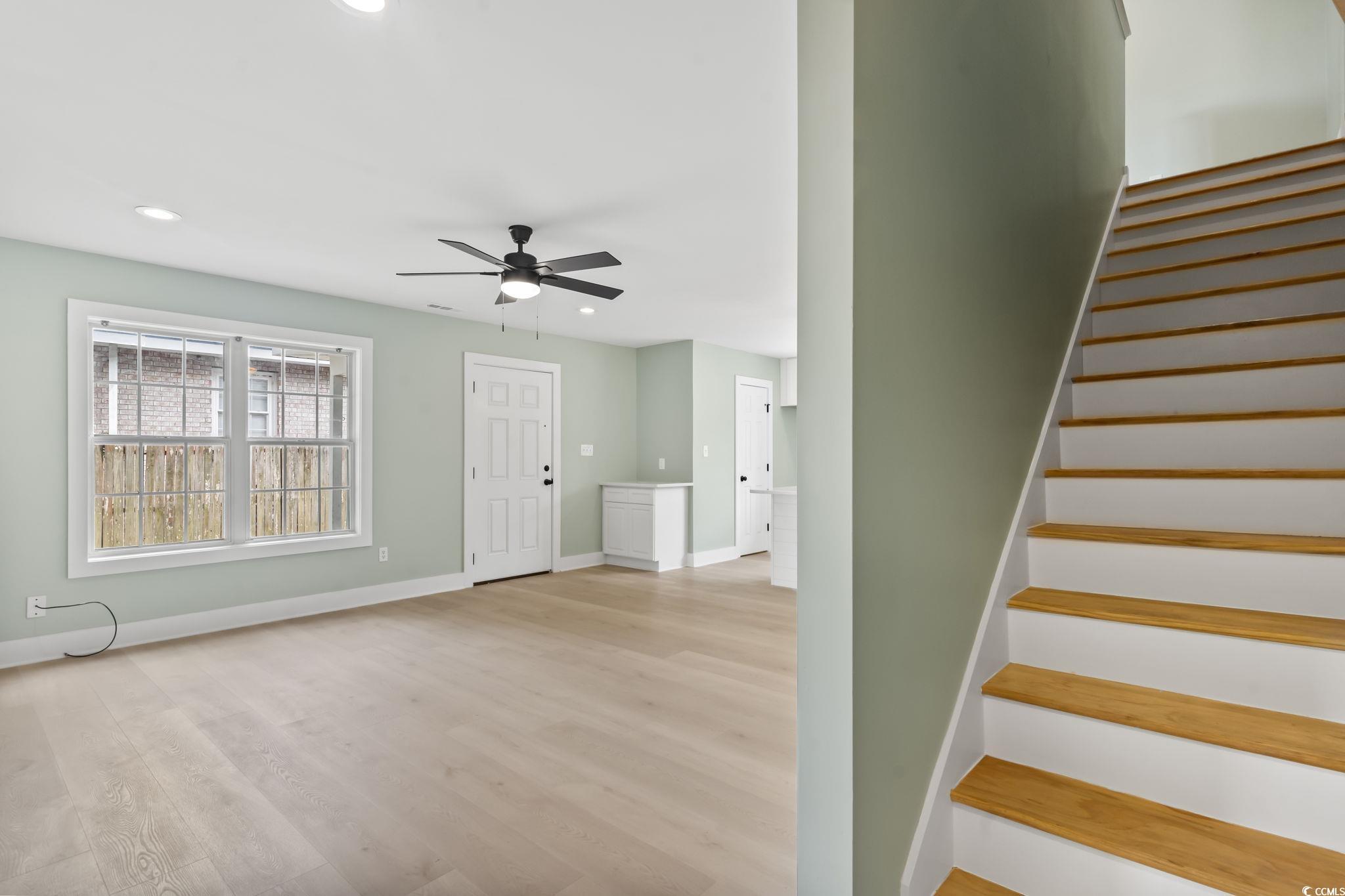 540 Boundary Avenue Murrells Inlet, SC 29576 - Photo 31 of 40 Stairway with light wood-type flooring and ceiling