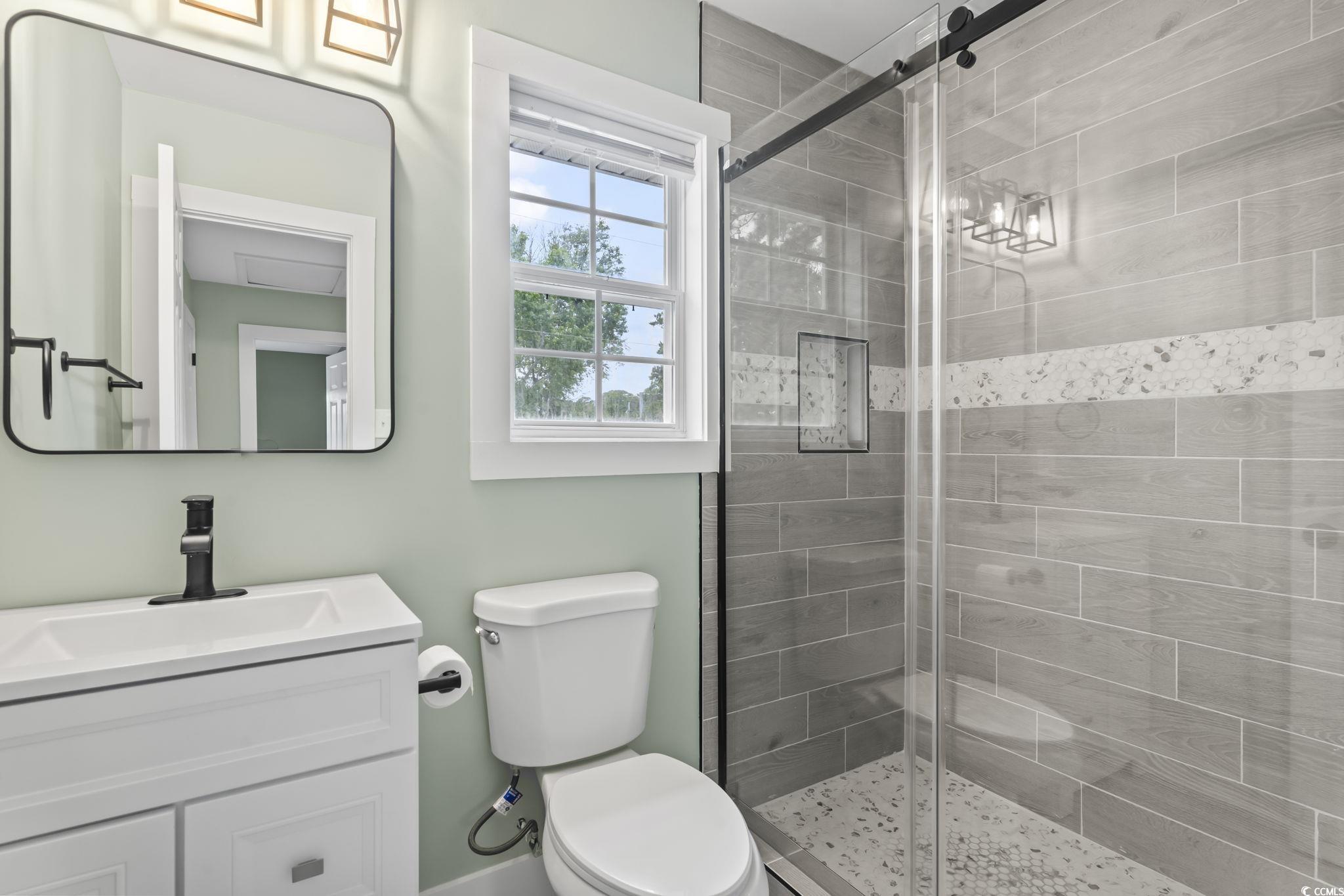540 Boundary Avenue Murrells Inlet, SC 29576 - Photo 32 of 40 Bathroom with an enclosed shower, toilet, and larg