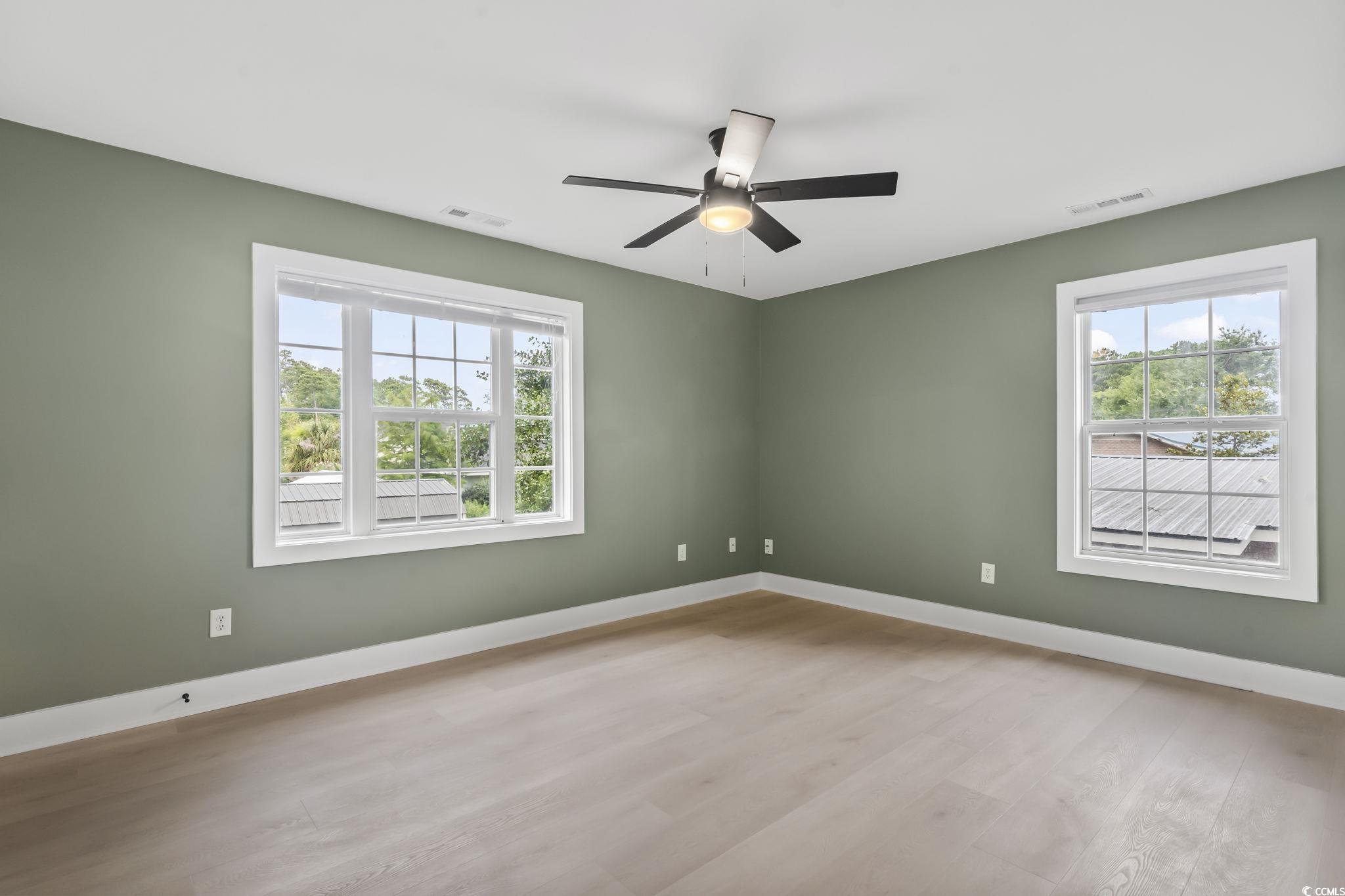 540 Boundary Avenue Murrells Inlet, SC 29576 - Photo 34 of 40 Empty room with a wealth of natural light, ceiling