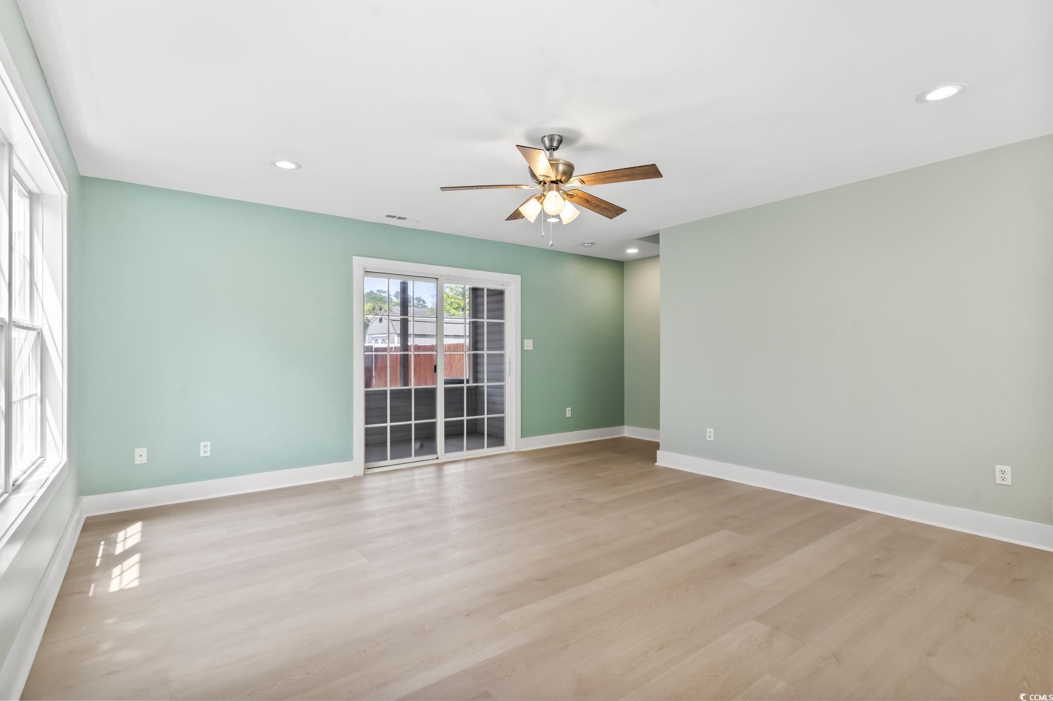 540 Boundary Avenue Murrells Inlet, SC 29576 - Photo 5 of 40 Spare room featuring ceiling fan and hardwood / wo