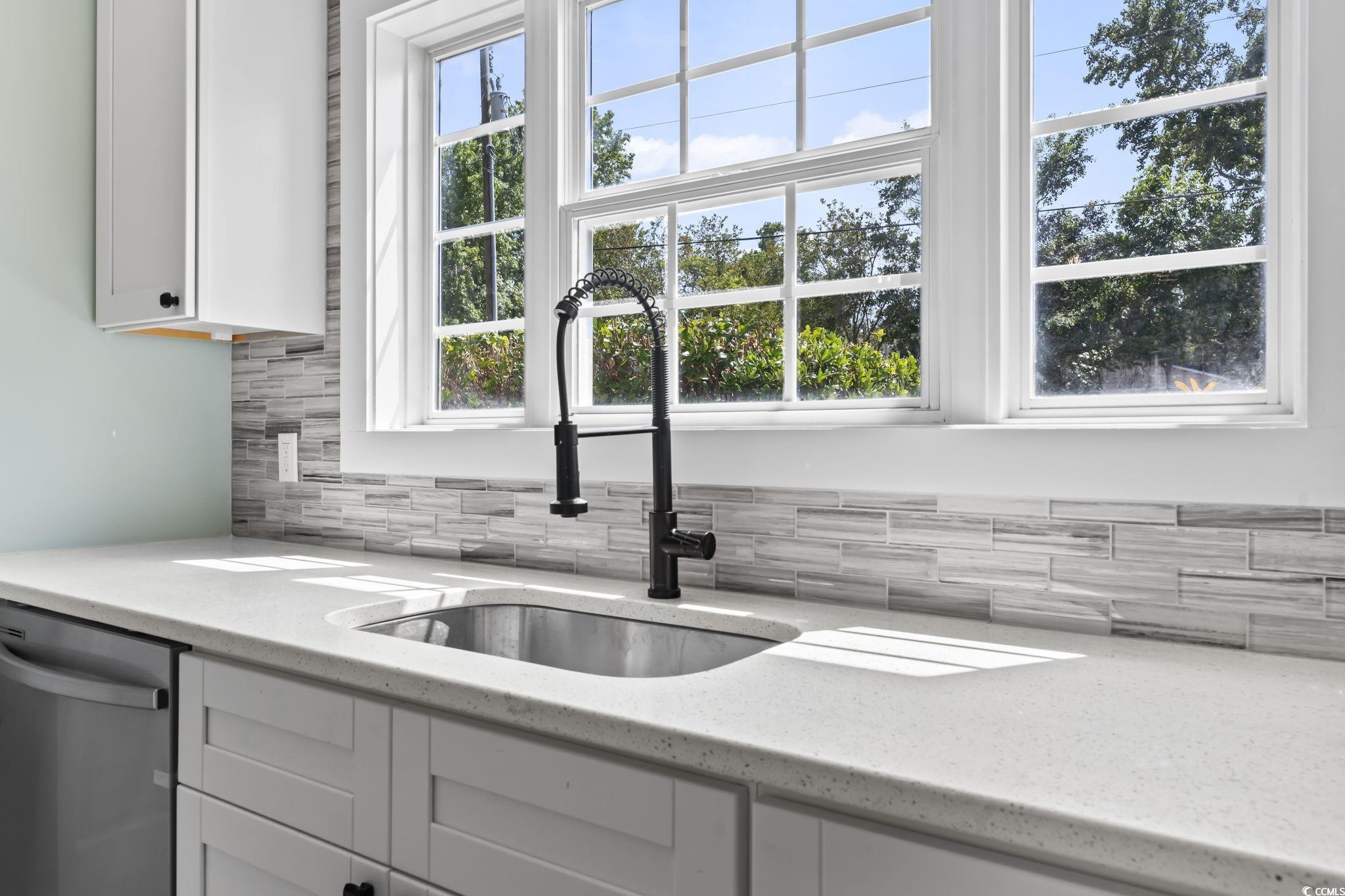 540 Boundary Avenue Murrells Inlet, SC 29576 - Photo 8 of 40 Kitchen with sink, white cabinetry, stainless stee
