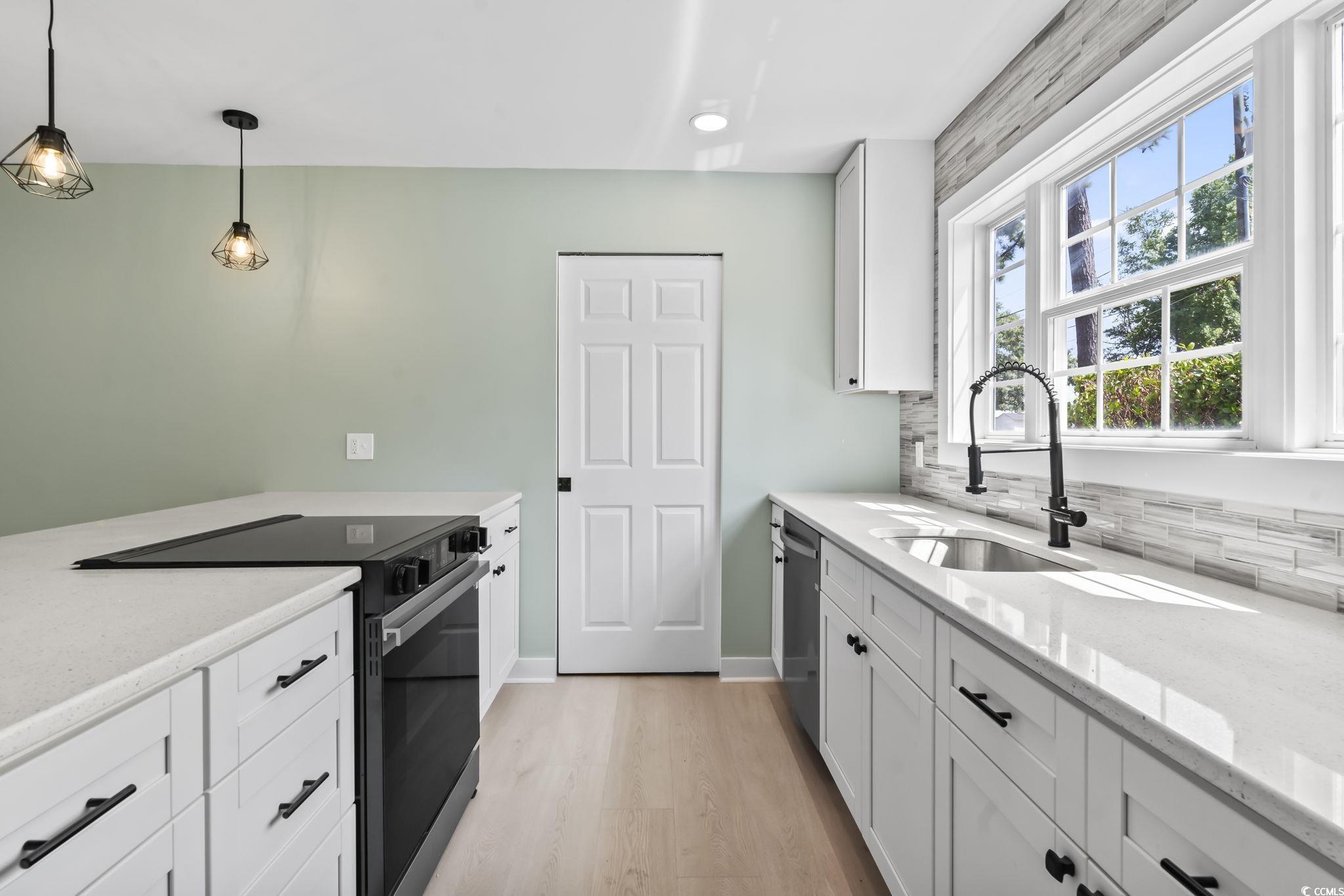 540 Boundary Avenue Murrells Inlet, SC 29576 - Photo 9 of 40 Kitchen featuring hanging light fixtures, light ha