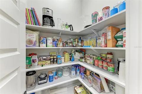 a bedroom with a bed and flat screen tv