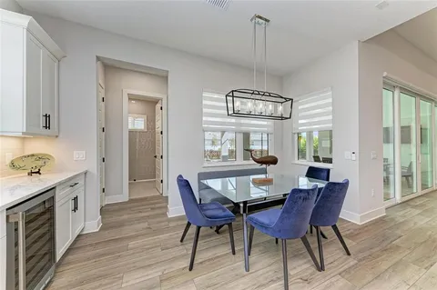 a bathroom with a granite countertop sink toilet and a mirror