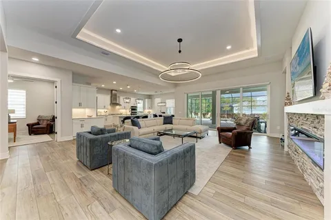 a living room with fireplace furniture and a flat screen tv