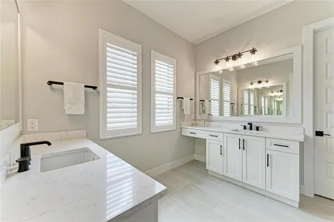 an aerial view of a residential building and lake view