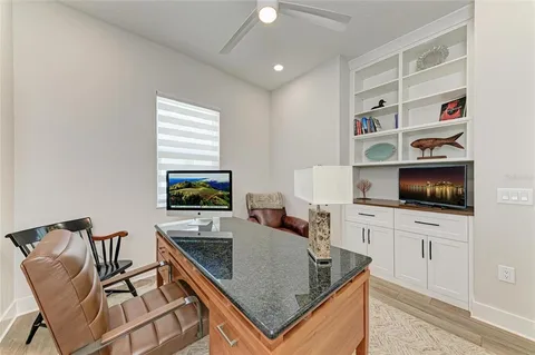 a kitchen with stainless steel appliances granite countertop a sink and a refrigerator