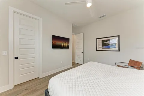 an aerial view of a residential building and ocean view