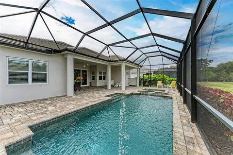 an aerial view of a chairs and table on the terrace