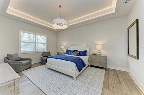 a spacious bedroom with a bed and a couch