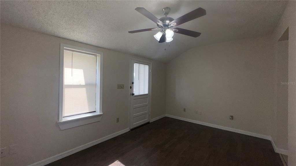 616 Massachusetts Avenue, Unit A St. Cloud, FL 34769 - Photo 3 of 15 an empty room with a window