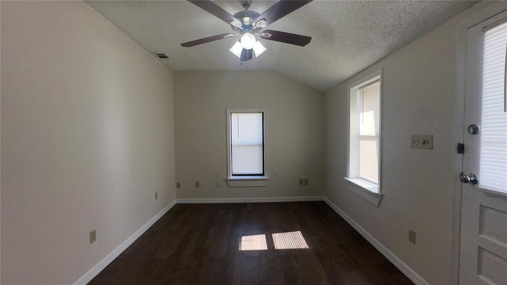 616 Massachusetts Avenue, Unit A St. Cloud, FL 34769 - Photo 4 of 15 a view of empty room with windows
