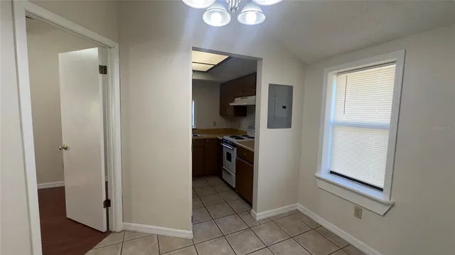 a kitchen with stainless steel appliances a sink a stove and microwave