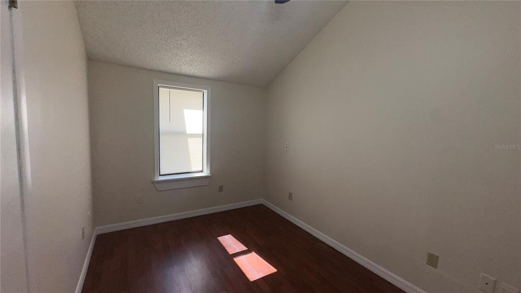 616 Massachusetts Avenue, Unit A St. Cloud, FL 34769 - Photo 10 of 15 an empty room with a window