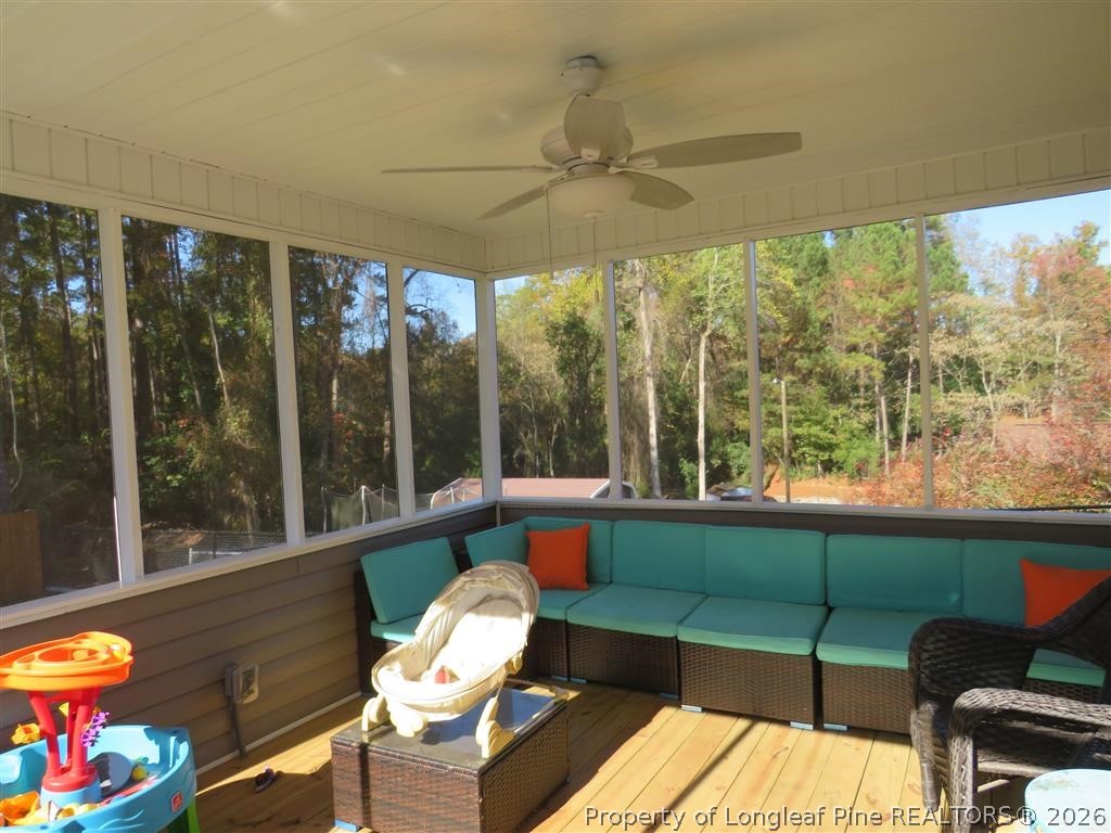 760 Ashbrook Road Fayetteville, NC 28314 - Photo 12 of 13 a living room with furniture and a floor to ceiling window