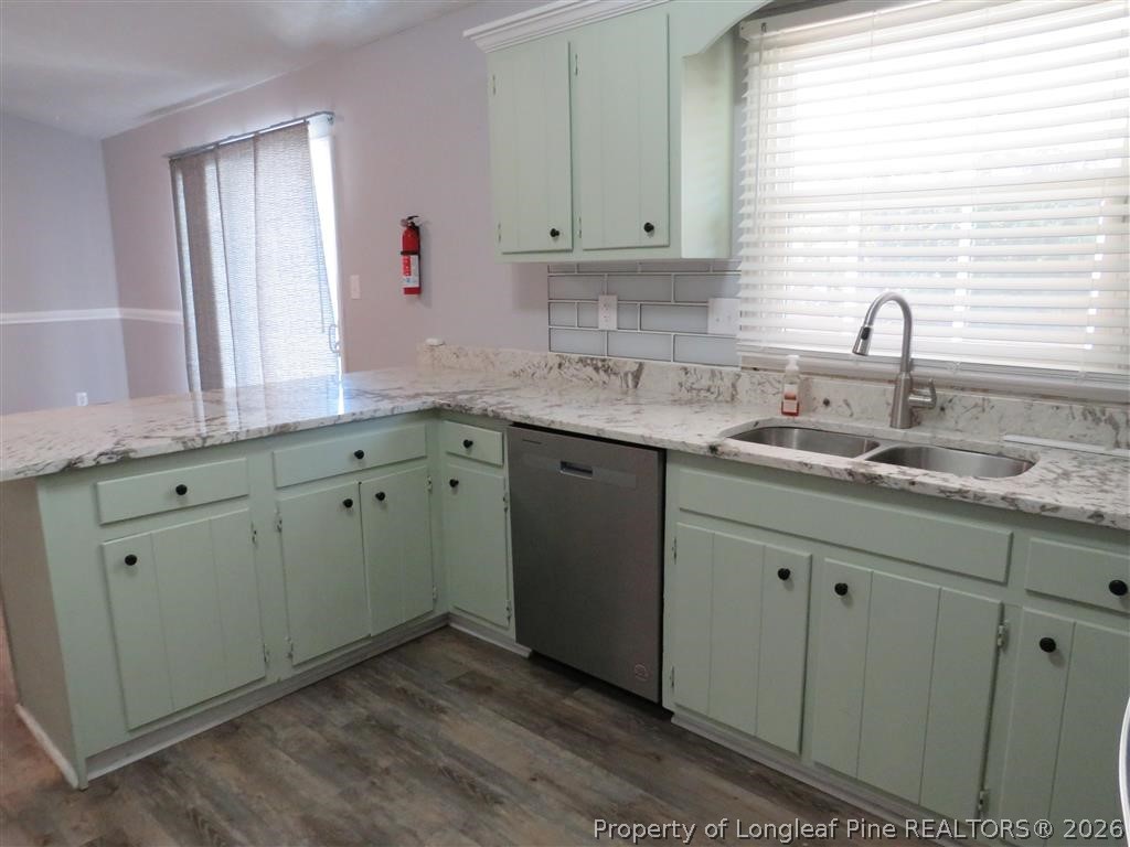 760 Ashbrook Road Fayetteville, NC 28314 - Photo 4 of 13 a kitchen with a sink cabinets and window