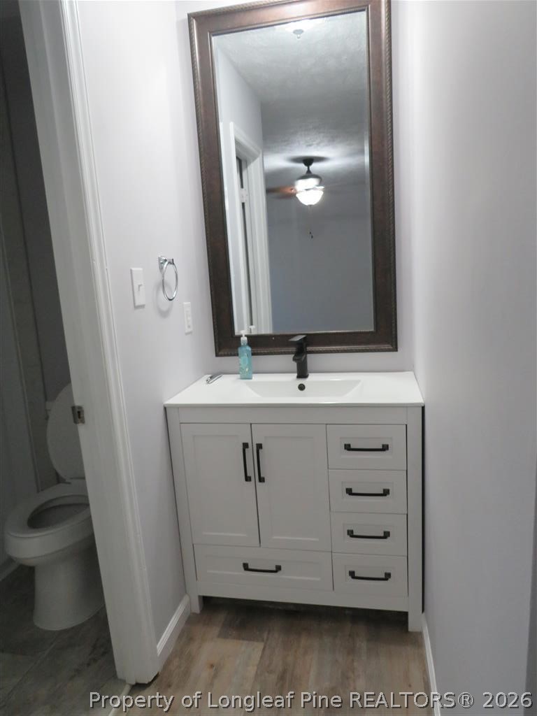 760 Ashbrook Road Fayetteville, NC 28314 - Photo 9 of 13 a bathroom with a sink and a mirror