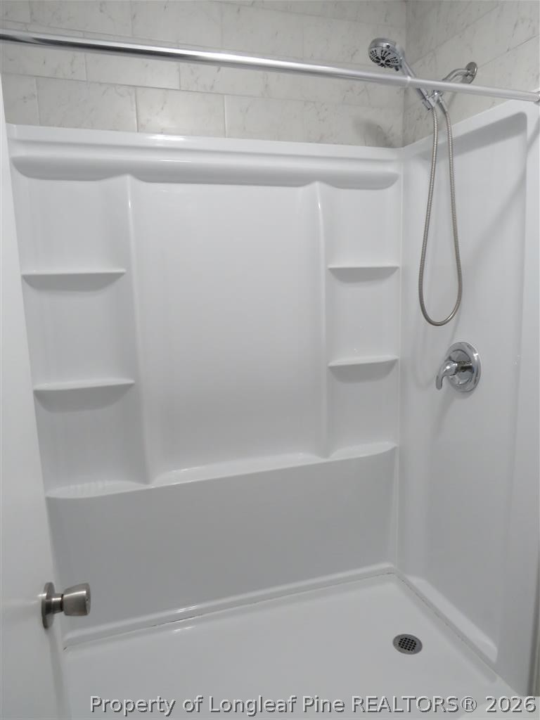760 Ashbrook Road Fayetteville, NC 28314 - Photo 10 of 13 a bathroom with a shower