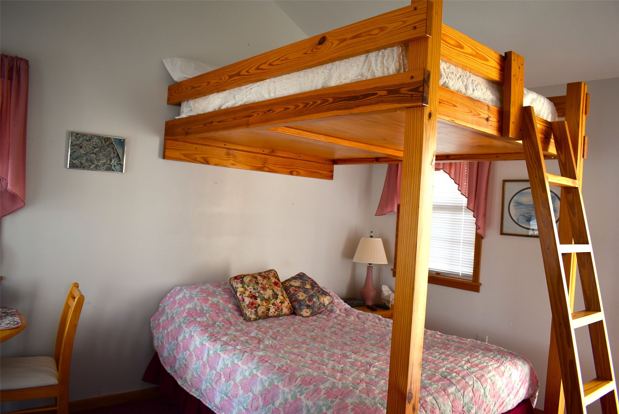 1657 County Road Sargent, TX 77414 - Photo 24 of 46 a bedroom with a bed and wooden floor