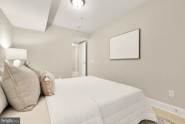 a bedroom with a bed and a couch