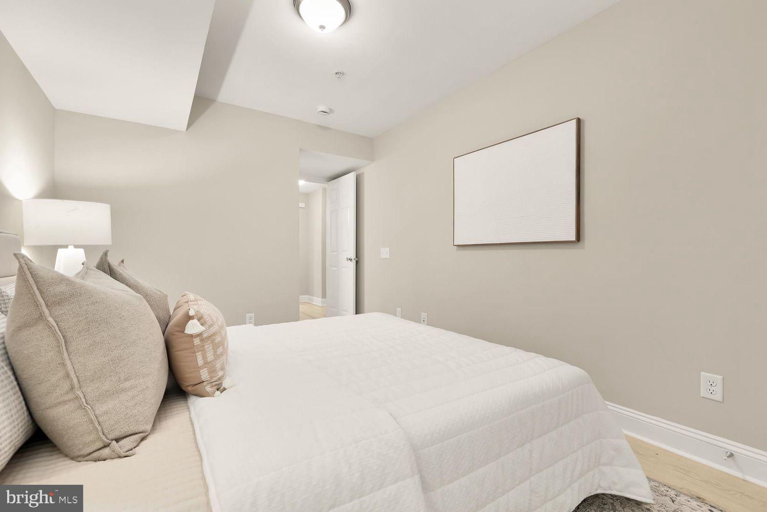 1753 W Street Southeast, Unit B Washington, DC 20020 - Photo 17 of 27 a bedroom with a bed and a couch