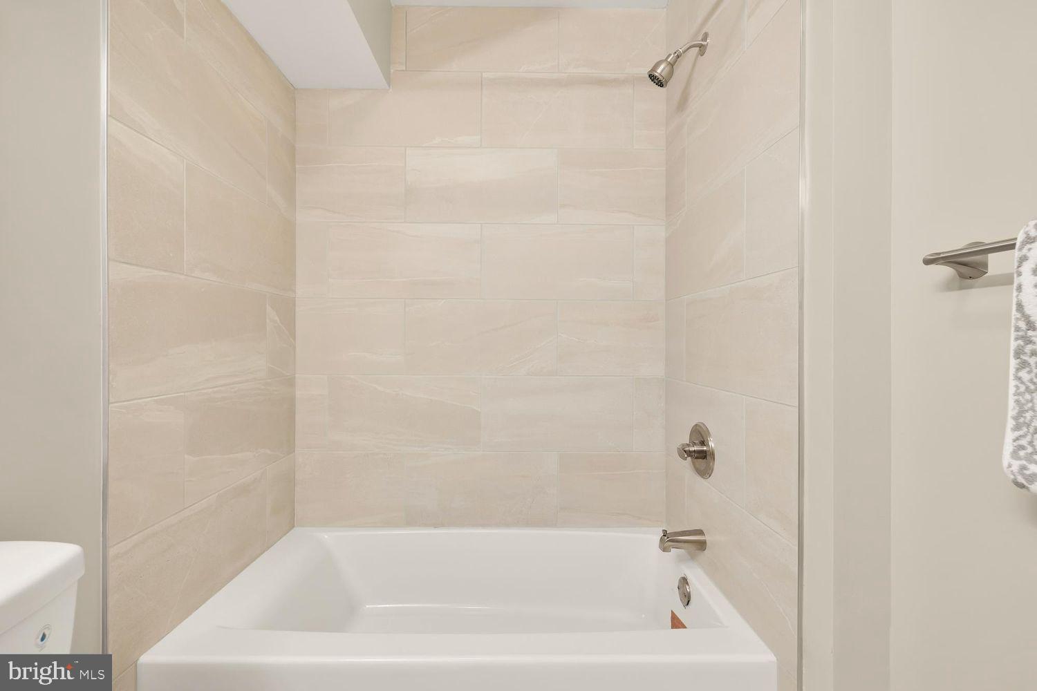1753 W Street Southeast, Unit B Washington, DC 20020 - Photo 21 of 27 a bathroom with a bathtub