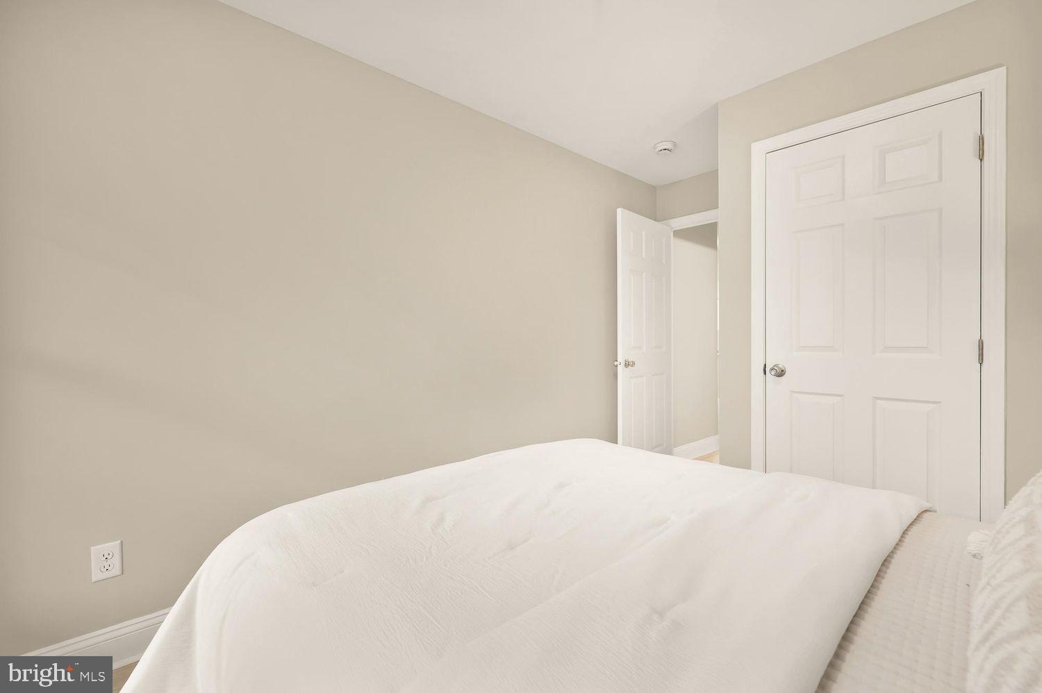 1753 W Street Southeast, Unit B Washington, DC 20020 - Photo 24 of 27 a large white bed in a white room