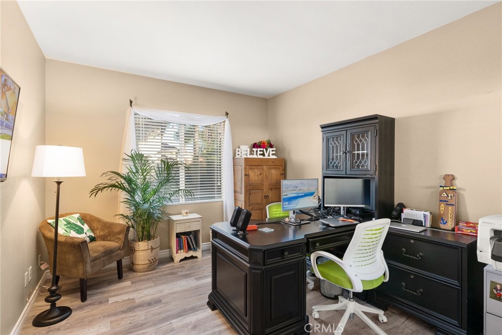 29602 Cool Meadow Drive Menifee, CA 92584 - Photo 11 of 31 a living room with furniture and a lamp