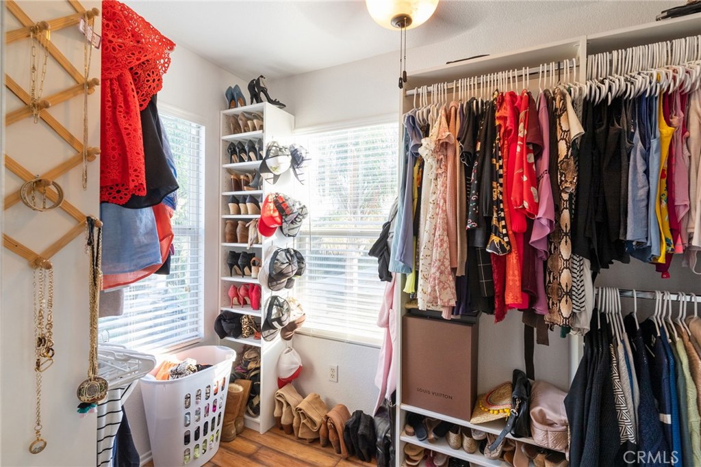 29602 Cool Meadow Drive Menifee, CA 92584 - Photo 13 of 31 a view of walk in closet with clothes