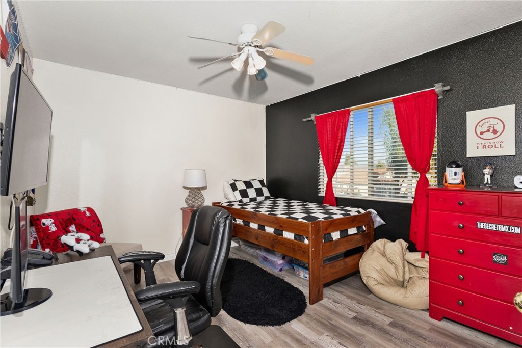 29602 Cool Meadow Drive Menifee, CA 92584 - Photo 16 of 31 a bedroom with a bed and a dresser in it