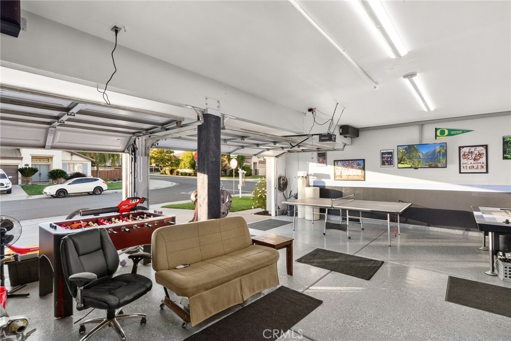 29602 Cool Meadow Drive Menifee, CA 92584 - Photo 23 of 31 a living room with furniture a rug and a chandelier